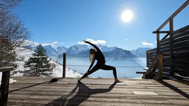 Yoga on a snowy mountain terrace